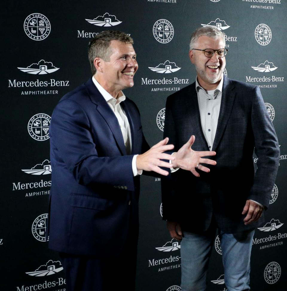 Tuscaloosa Mayor Walt Maddox and President and Chief Executive Officer of Mercedes-Benz U.S. International Michael Goebel pose for a photo after renaming the Tuscaloosa Amphitheater the Mercedes-Benz Amphitheater between concerts by Loverboy and Foreigner Tuesday, Nov. 7, 2023.