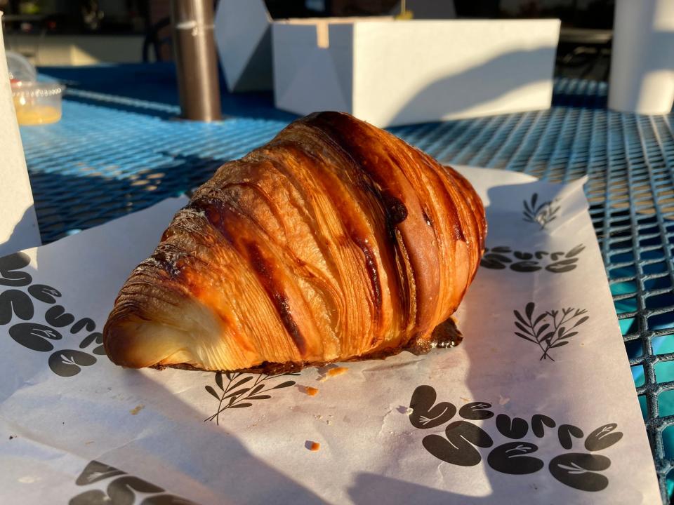 Plain croissant from Beurre Sec outside Lulu's Coffee and Bakehouse on Sept. 24, 2023. The croissant features over a dozen distinct layers of dough.