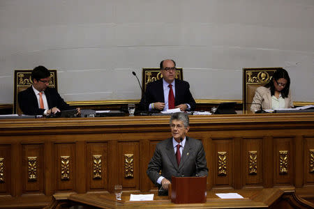 Henry Ramos Allup (bottom C), deputy of the Venezuelan coalition of opposition parties (MUD), speaks during a session of the National Assembly in front of his fellow deputies Julio Borges (top C), President of the National Assembly, first Vice President of the chamber Freddy Guevara (top L), and second Vice President of the chamber Dennis Fernandez, in Caracas, Venezuela April 5, 2017. REUTERS/Marco Bello