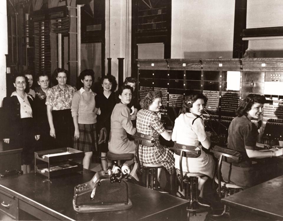 Early Pioneer Telephone operators at their cord boards.