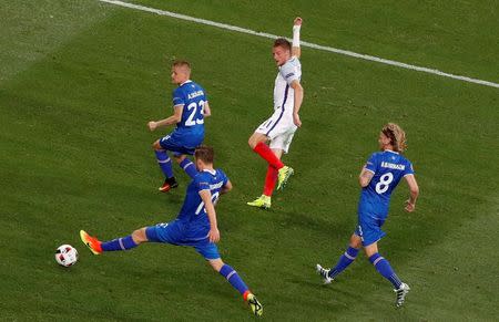 Football Soccer - England v Iceland - EURO 2016 - Round of 16 - Stade de Nice, Nice, France - 27/6/16 England's Jamie Vardy in action with Iceland's Ari Skulason, Gylfi Sigurdsson and Birkir Bjarnason REUTERS/Yves Herman Livepic