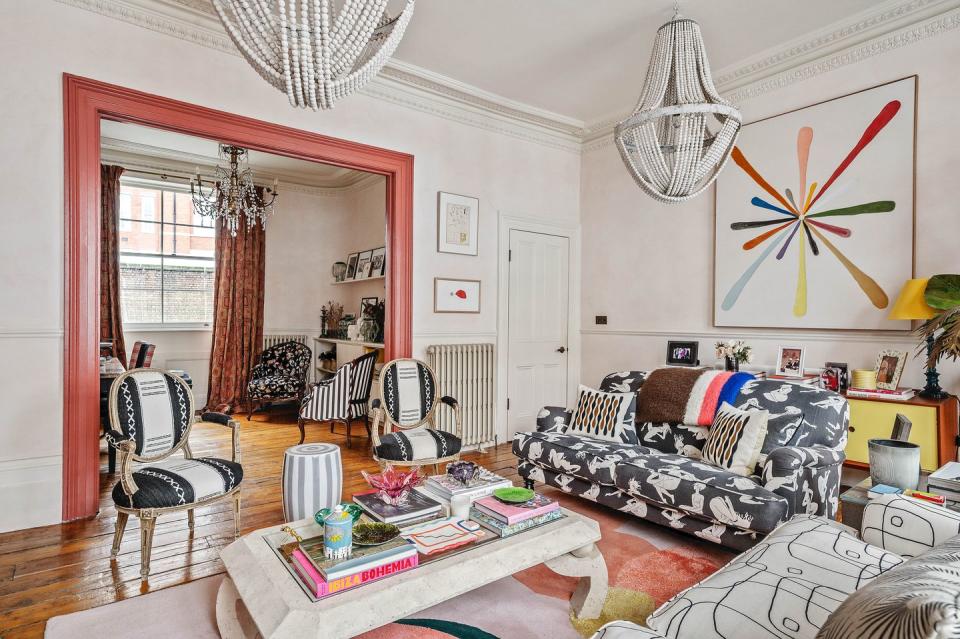 colourful living room with sofas, chairs and a coffee table