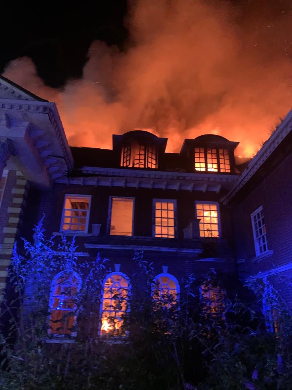 The roof of the three-storey mansion was completely destroyed in the blaze (London Fire Brigade via Twitter)