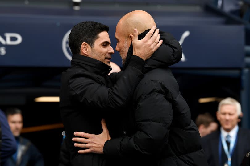 Arsenal manager Mikel Arteta (L) with Manchester City boss Pep Guardiola