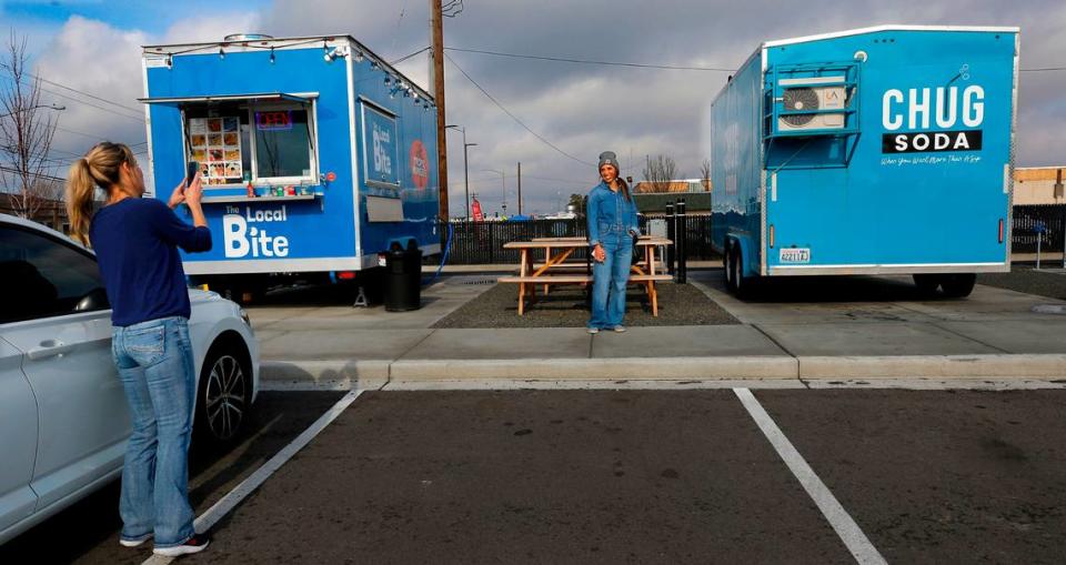 Rachel Magelsen, co-owner of Chug Soda, poses for a photo by her next-door business neighbor Rachel Lundegard while setting up her food trailer in the Edison Street Food Park in Kennewick. Lundeward’s The Local Bite and Tropic Hunger food trailer was the first one to occupy a space at the venue on West Okanogan Avenue and North Edison Street. Bob Brawdy/bbrawdy@tricityherald.com