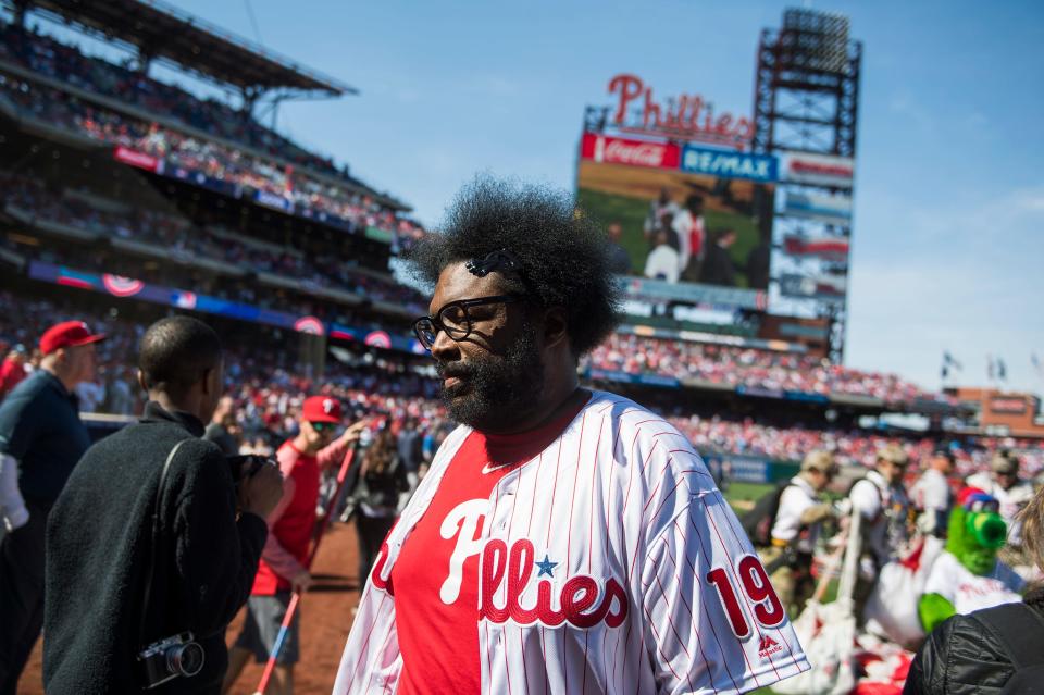 Questlove exits the filed after throwing a pitch before a home opener between the Phillies and Braves Thursday, March 28, 2019 in Philadelphia.