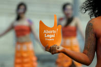 Pro abortion activists demonstrate in front of the Uruguayan congress in Montevideo, Uruguay, Tuesday, Sept. 25, 2012. Uruguay's congress appeared ready on Tuesday to legalize abortion, a groundbreaking move in Latin America, where no country save Cuba has made abortions accessible to all women during the first trimester of pregnancy. The sign reads in Spanish "legal abortion." (AP Photo/Matilde Campodonico)