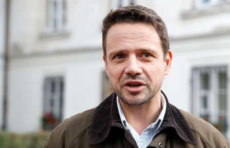 Rafal Trzaskowski, Civic Coalition candidate for mayor of Warsaw, poses outside the polling station after casting his vote during the Polish regional elections, in Warsaw, Poland October 21, 2018. REUTERS/Kacper Pempel