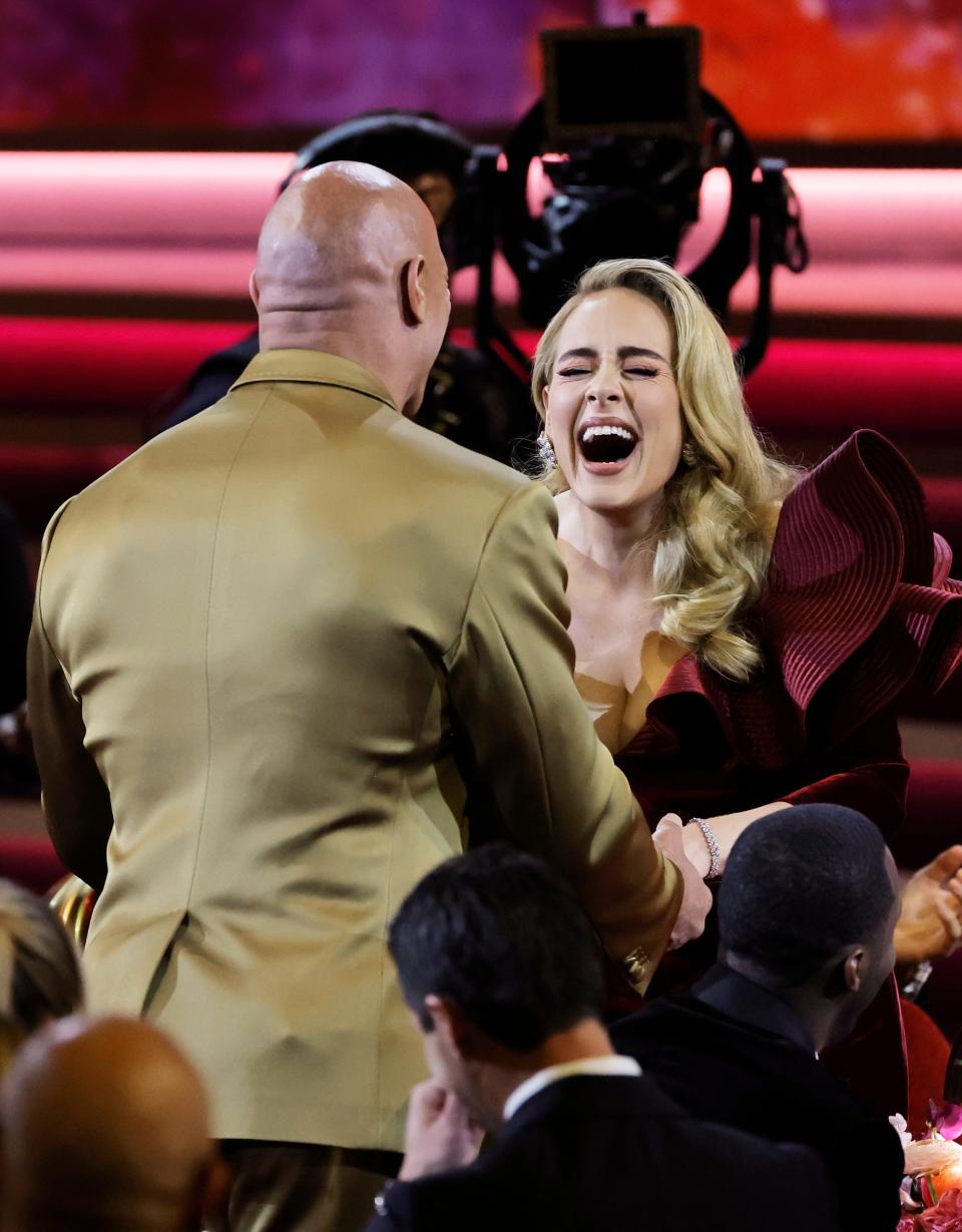 (L-R) Dwayne Johnson and Adele meet at the 65th Grammys.