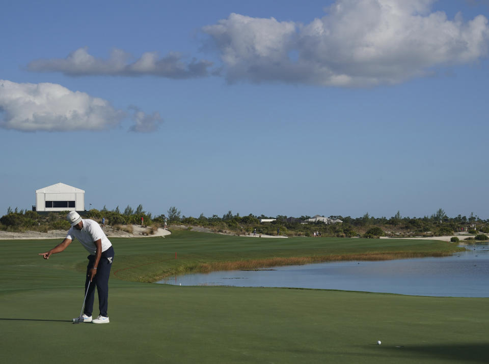 Tony Finau, of the United States, reacts to his birdie on the 18th hole during the second round of the Hero World Challenge PGA Tour at the Albany Golf Club, in New Providence, Bahamas, Friday, Dec. 3, 2021.(AP Photo/Fernando Llano)