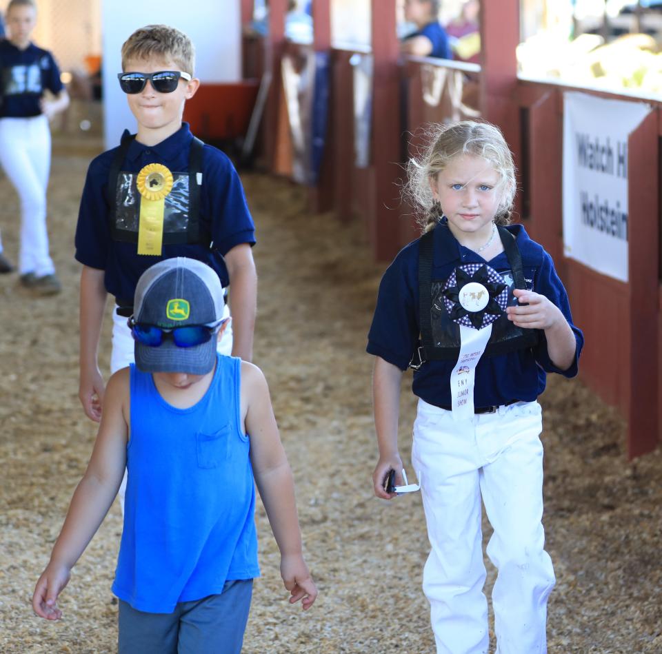 From left, Beach, Dylan and Emily Burlingame at the ENY Junior Holstein Club Black & White Show at the Dutchess County Fairgrounds on July 22, 2022. 