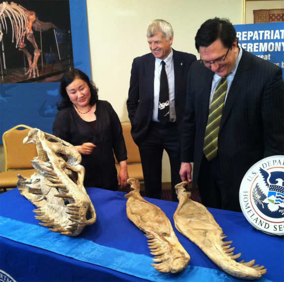 Before a repatriation ceremony to return dinosaur fossils to Mongolia, three people involved in the case, paleontologists Bolortsetseg Minjin and Philip Currie, and attorney Robert Painter posed with the fossils.