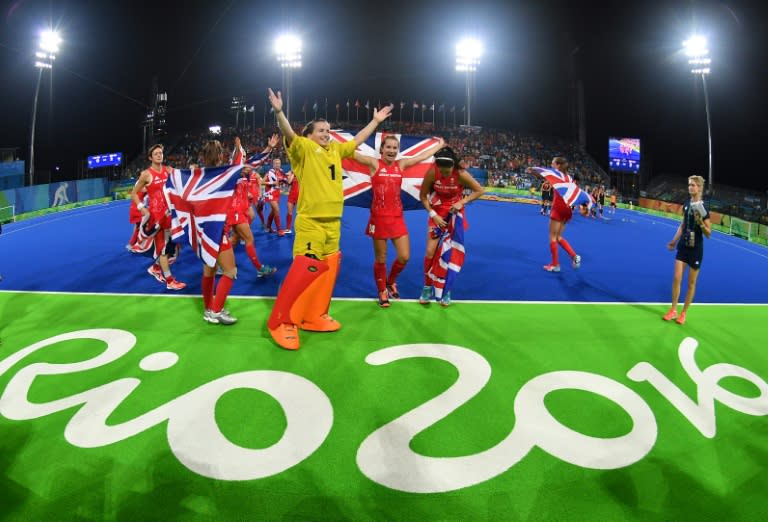 Britain's players celebrate their victory at the end of the women's gold medal hockey match against Netherlands at the Rio 2016 Olympics Games