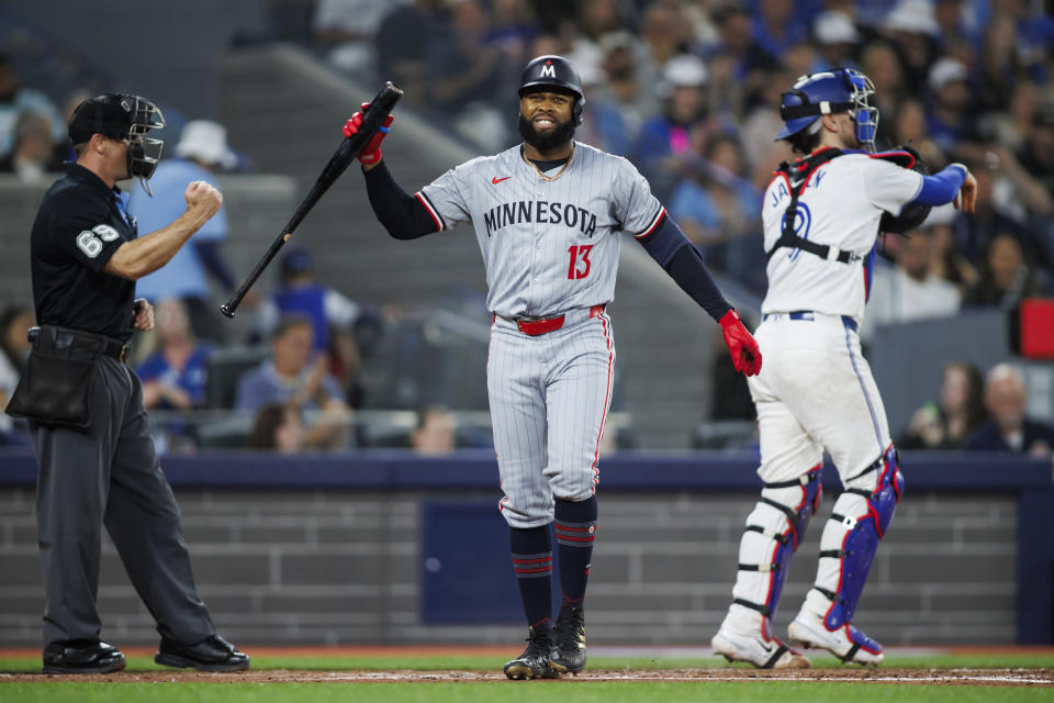 Minnesota Twins' Manuel Margot (13) reacts after striking out against the Toronto Blue Jays during the fourth inning of a baseball game Friday, May 10, 2024, in Toronto. (Cole Burtson/The Canadian Press via AP)