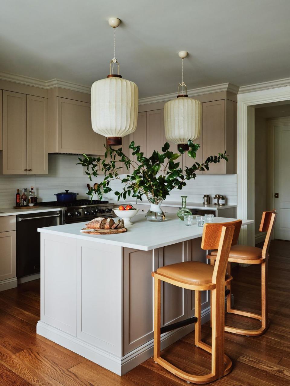 a kitchen with a table and chairs