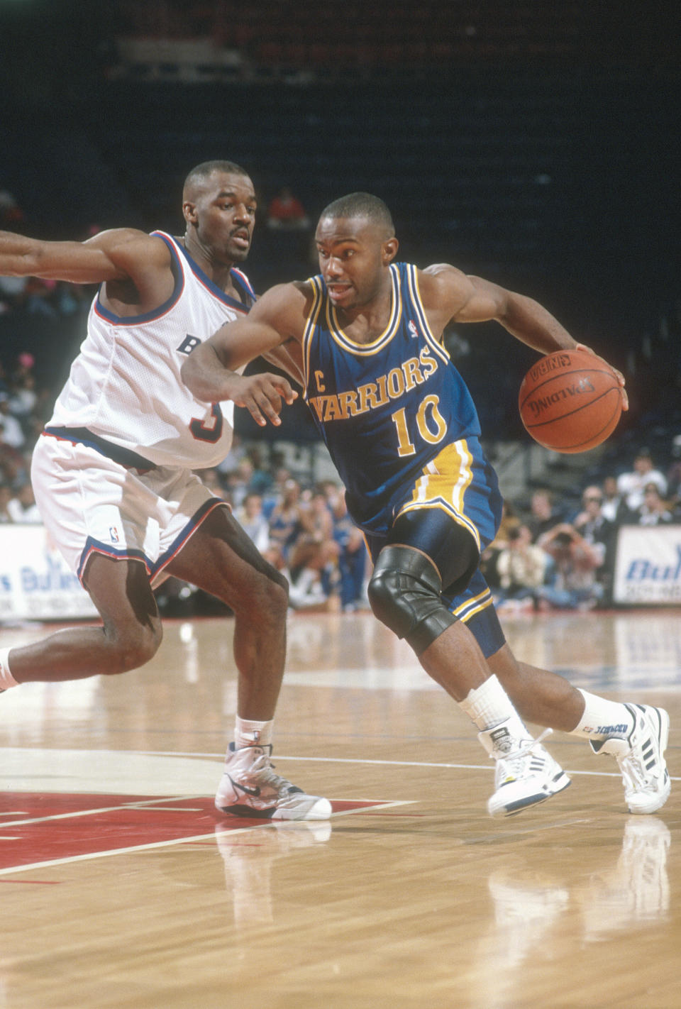 Tim Hardaway drives to the hoop in 1990. (Photo by Focus on Sport/Getty Images)