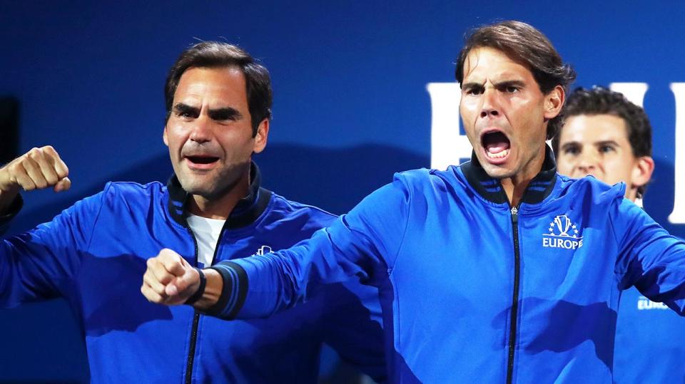 Roger Federer (pictured left) and Rafa Nadal (pictured right) jump up and celebrate.