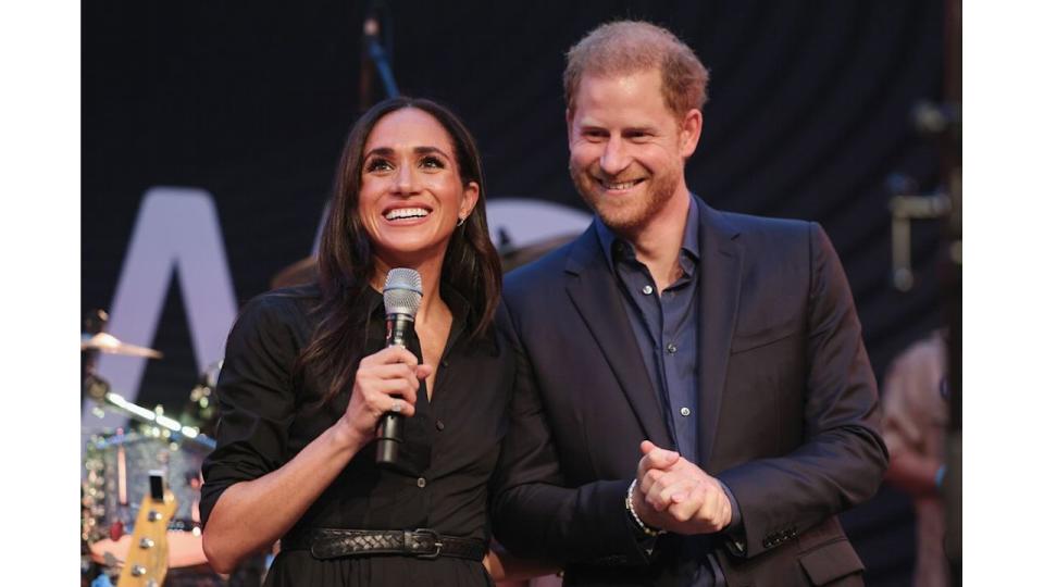 Meghan Markle standing with Prince Harry