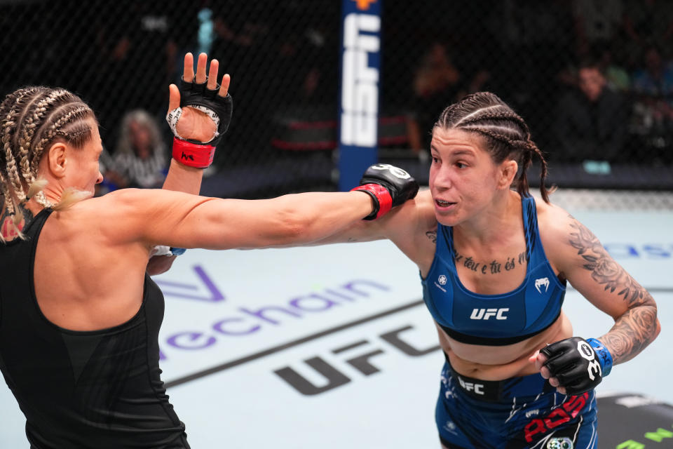 LAS VEGAS, NEVADA – JULY 01: (R-L) Karol Rosa of Brazil punches Yana Santos of Russia in a featherweight fight during the UFC Fight Night event at UFC APEX on July 01, 2023 in Las Vegas, Nevada. (Photo by Chris Unger/Zuffa LLC via Getty Images)