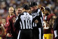 Head coach Mike Shanahan of the Washington Redskins yells at back judge Tony Steratore #112 in the third quarter while taking on the New York Giants at FedExField on December 3, 2012 in Landover, Maryland. (Photo by Patrick McDermott/Getty Images)