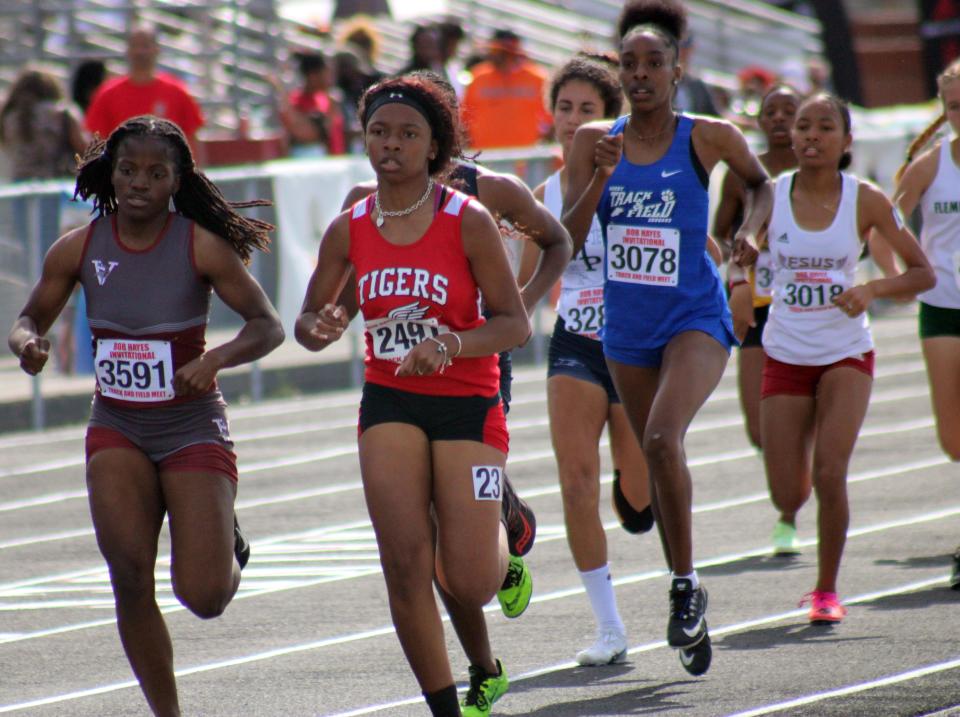 Selket Reid-El (left) leads the pack while racing for Raines High School in the girls 800-meter run at the Bob Hayes Invitational Track Meet in March. She placed fourth among Duval County Public Schools runners this year in the 800, and qualified for the Florida High School Athletic Association regional championships earlier this May.
