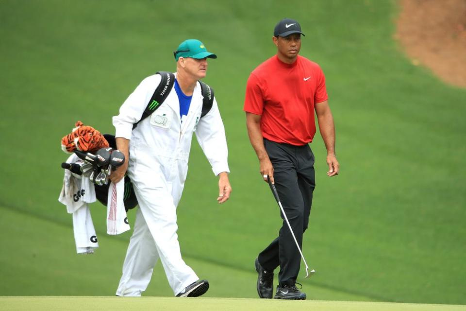 Tiger Woods and his caddie Joe LaCava | Andrew Redington/Getty Images