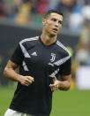 Juventus forward Cristiano Ronaldo warms up prior to the Serie A soccer match between Udinese and Juventus, at the Dacia Arena stadium in Udine, Italy, Saturday, Oct.6, 2018. Cristiano Ronaldo is back in Juventus' starting lineup, a week after a Nevada woman filed a civil lawsuit accusing him of rape nine years ago. (AP Photo/Antonio Calanni)