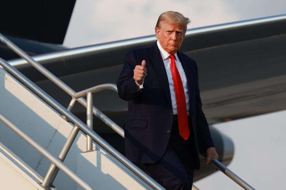 Former U.S. President Donald Trump gives a thumbs up as he arrives at Atlanta Hartsfield-Jackson International Airport on August 24, 2023 in Atlanta, Georgia. (Getty Images)
