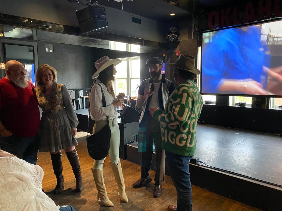 Kayla Hutton, second from left, and her father look on as chef Zach Hutton chats with Kinsey Taylor and Trent Ward during an April 9 "Chopped" watch party at Ponyboy in Oklahoma City.