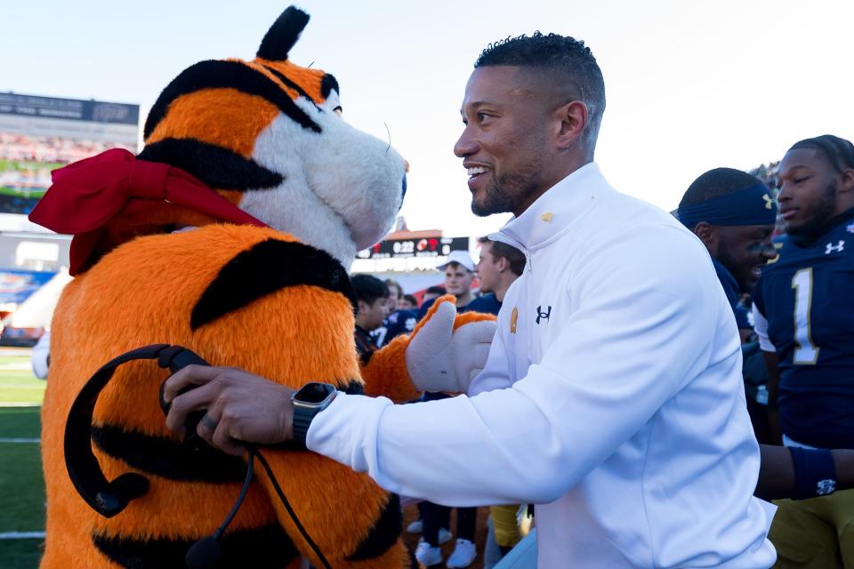 Notre Dame head football coach Marcus Freeman hugs Tony the Tiger after his 40-8 win against Oregon State in the 90th annual Sun Bowl game on Friday, Dec. 29, 2023, at El Paso, Texas.