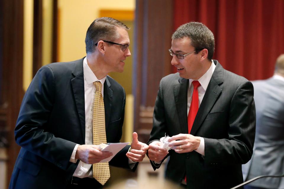 Sen. Randy Feenstra, left, talks with state Sen. Roby Smith in the Iowa Legislature in 2019. Feenstra will face Democrat J.D. Scholten in November for Congress. (Charlie Neibergall/ASSOCIATED PRESS)