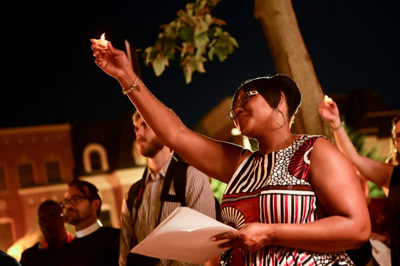 FILE PHOTO: Participants hold a "Silent March Commemorating the Journey of the Enslaved" to mark 400th anniversary of first enslaved African people arriving in Virginia