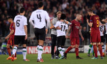 <p>Soccer Football – Champions League Semi Final Second Leg – AS Roma v Liverpool – Stadio Olimpico, Rome, Italy – May 2, 2018 Liverpool manager Juergen Klopp celebrates after the match with Mohamed Salah as Roma’s Radja Nainggolan and Edin Dzeko look dejected REUTERS/Alberto Lingria </p>