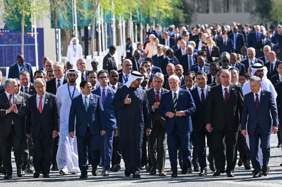 COP28 President Sultan Ahmed al-Jaber, center, walks with world leaders and representatives of countries to the climate summit’s opening ceremony. The loss and damage fund was one of the first items approved. <a href="https://www.gettyimages.com/detail/news-photo/leaders-and-representatives-of-countries-are-seen-upon-news-photo/1814982687" rel="nofollow noopener" target="_blank" data-ylk="slk:Stringer/Anadolu via Getty Images;elm:context_link;itc:0;sec:content-canvas" class="link ">Stringer/Anadolu via Getty Images</a>