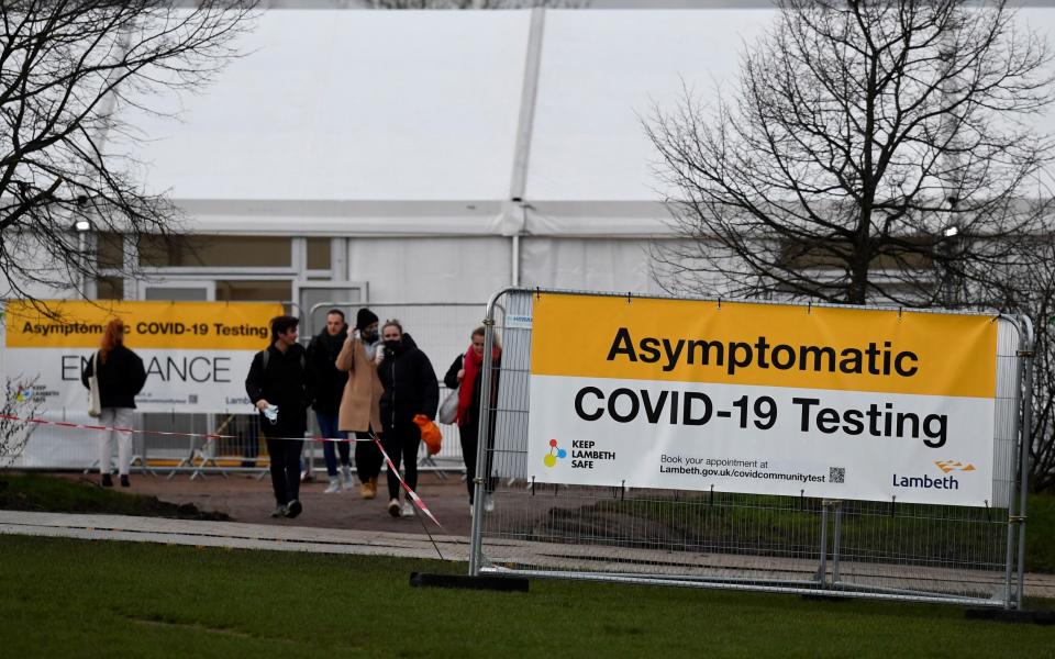 People wait for Covid tests in London amid rising virus cases earlier this month - Toby Melville/Reuters