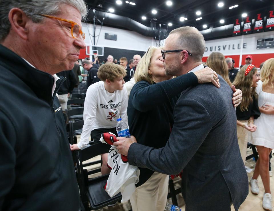 Louisville coach Pat Kelsey gets a hug from his mom, Linda, after he was introduced Thursday.