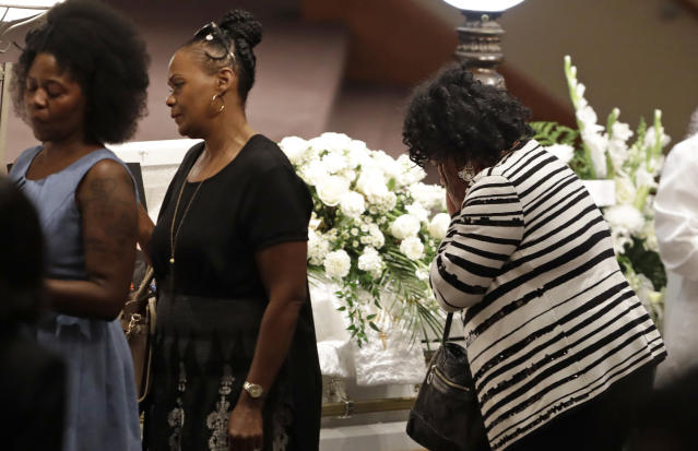 The Latest: 100s at funeral for 5 relatives killed in boat