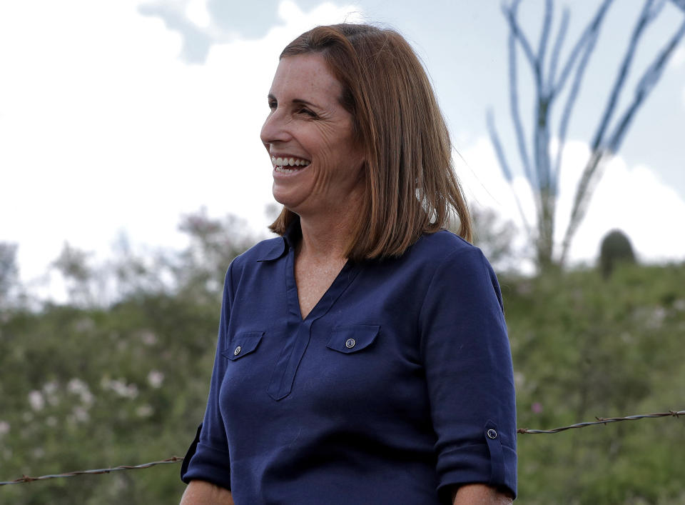 File - In this Aug. 22, 2018, file photo, U.S. Senatorial candidate U.S. Rep. Martha McSally, R-Ariz., laughs while touring the international border with Mexico, south of Arivaca, Ariz. In her bid to become the Republican Senate nominee, McSally is facing former Maricopa County Sheriff Joe Arpaio and Dr. Kelli Ward for the republican nomination in Tuesday's statewide primary. (AP Photo/Matt York, File)