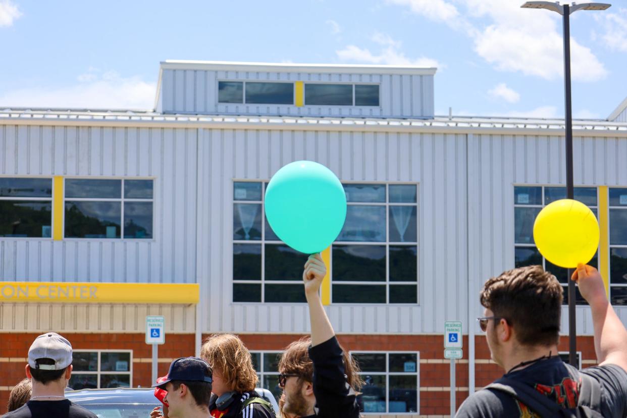 On May 8, students at Midland Innovation and Technology Charter School organized a walk out during their lunch break. Amid their protest, they carried blue and yellow balloons.