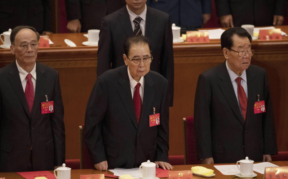 CORRECTS AGE TO 90, INSTEAD OF 91 - In this Oct. 24, 2017, photo, former Chinese Premier Li Peng, center, attends the closing session of China's 19th Party Congress at the Great Hall of the People in Beijing, China. Li Peng, a former hard-line Chinese premier best known for announcing martial law during the 1989 Tiananmen Square pro-democracy protests, has died on Monday July 22, 2019 of unspecified illness. He was 90. (AP Photo/Ng Han Guan)