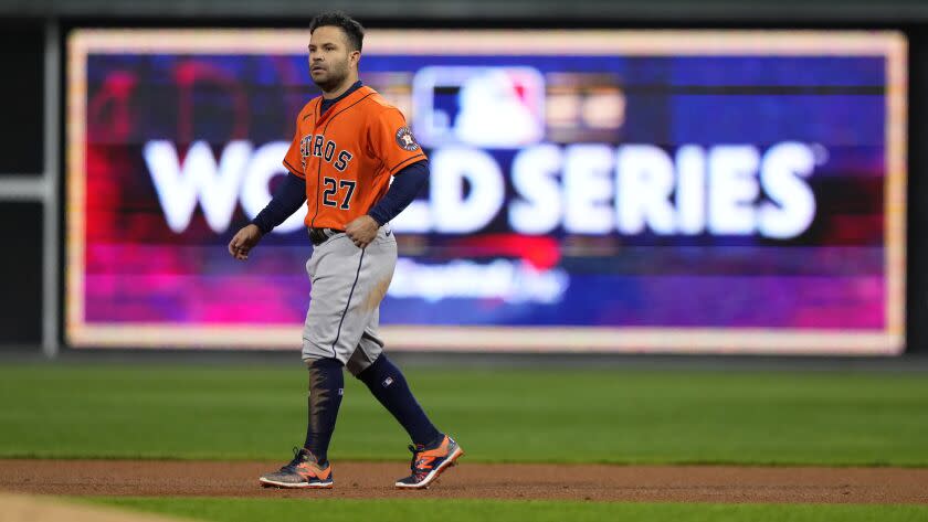 Houston Astros' Jose Altuve walks on the field during the third inning in Game 5 of baseball's World Series.