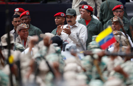 Venezuela's President Nicolas Maduro takes part in a ceremony to mark the 17th anniversary of the return to power of Venezuela's late President Hugo Chavez after a coup attempt and the National Militia Day in Caracas, Venezuela April 13, 2019. REUTERS/Carlos Garcia Rawlins