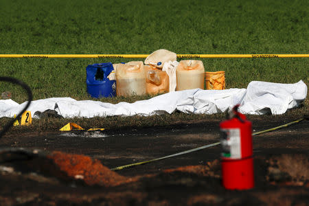 Body bags are seen lined up next to fuel canisters at the site where a fuel pipeline ruptured by suspected oil thieves exploded, in the municipality of Tlahuelilpan, state of Hidalgo, Mexico January 19, 2019. REUTERS/Henry Romero