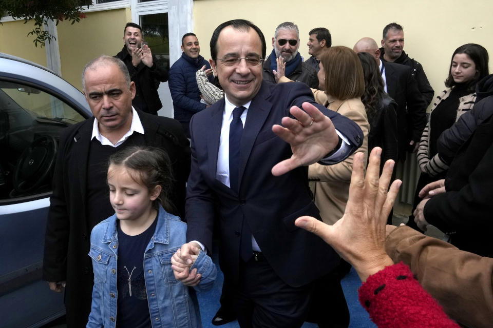 Presidential candidate and former foreign minister Nikos Christodoulides waves to supporters after casting his vote during the presidential elections in Geroskipou in south west coastal city of Paphos, Cyprus, Sunday, Feb. 5, 2023. Cypriots began voting for their eighth new president in the ethnically divided island’s 62-year history as an independent republic, with three front-runners each portraying themselves as the safest bet to guide the country through turbulent economic times and to seek peace with breakaway Turkish Cypriots. (AP Photo/Petros Karadjias)