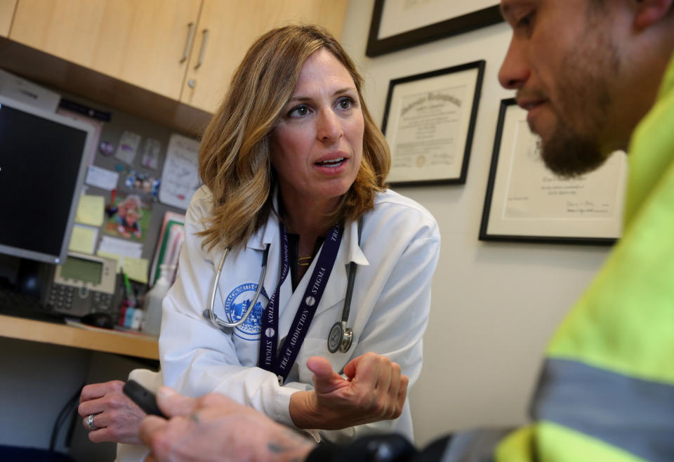 BOSTON, MA - APRIL 27: Dr. Laura Kehoe talks to a patient during his appointment as Mass. General Hospital in Boston on April 27, 2018. The patient takes Suboxone, a medicine that contains buprenorphine and naloxone, to treat his substance use disorder. He said he had been addicted to Opioids for 10 years but has been drug free since he started taking Suboxone nearly 2 years ago.  (Photo by Craig F. Walker/The Boston Globe via Getty Images)