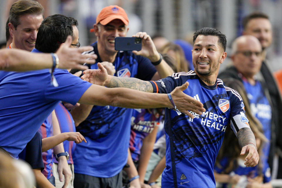 FC Cincinnati's Luciano Acosta, center right, celebrates with supporters after scoring a goal during the first half of an MLS soccer match against CF Montreal Wednesday, May 17, 2023, in Cincinnati. (AP Photo/Jeff Dean)