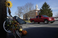 A pickup truck makes its past the courthouse Monday, Nov. 13, 2023, in Tompkinsville, Ky. (AP Photo/George Walker IV)
