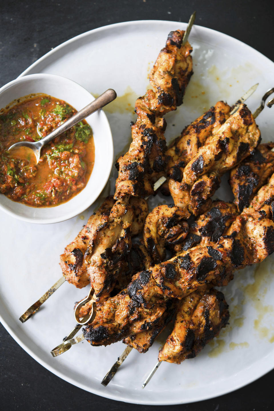 This image released by Milk Street shows a recipe for Turkish-style chicken kebabs. (Milk Street via AP)