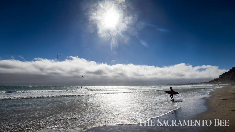 Windsurfers and kiteboarders ride the winds and waves of the Pacific Ocean at Waddell Beach in Big Basin Redwoods State Park, about 20 miles north of Santa Cruz