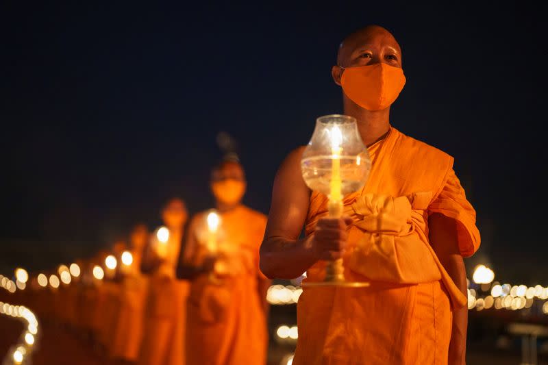 Buddhist devotees gather via Zoom application to commemorate Makha Bucha day in Thailand